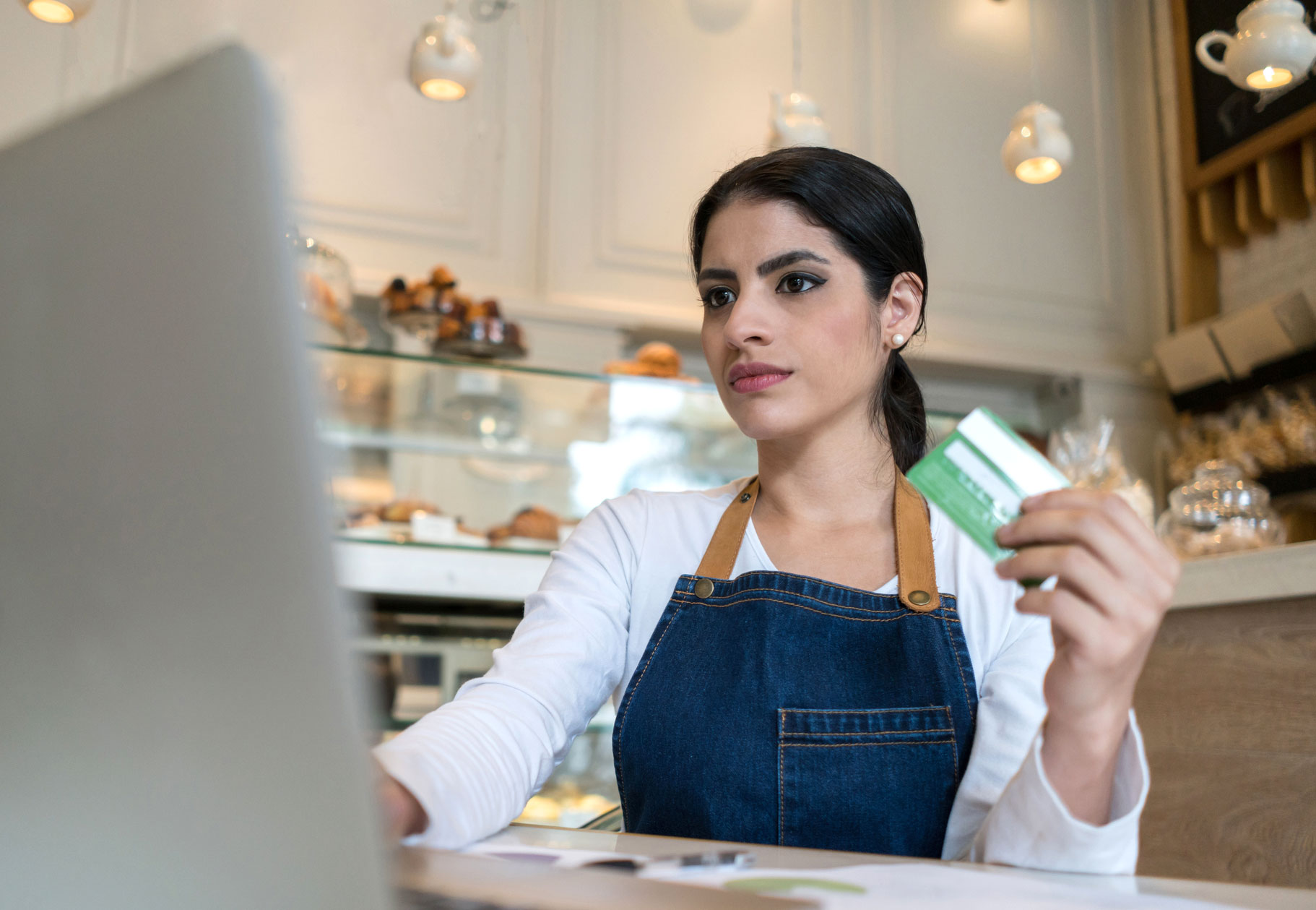 Business owner shopping for her café using a commercial credit card.