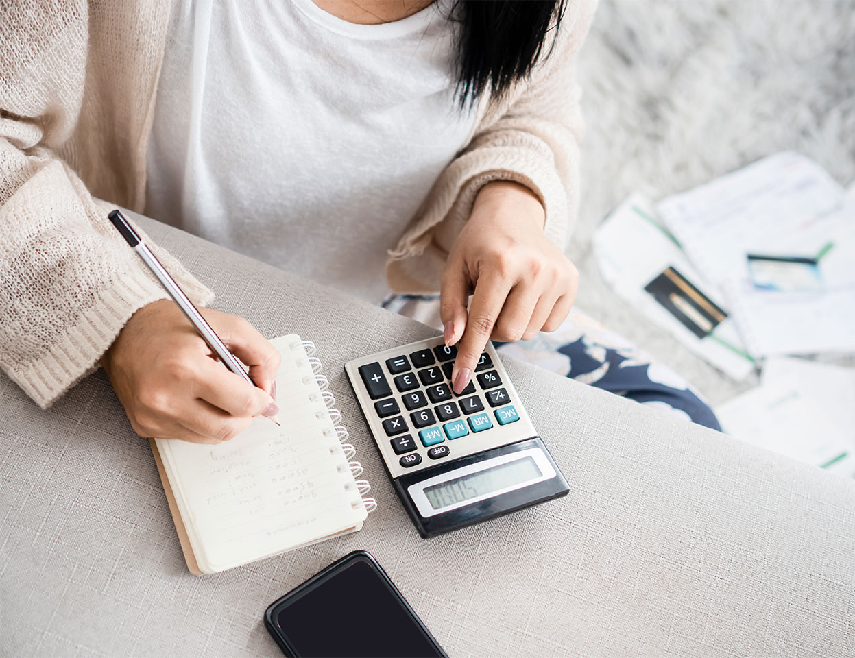 Woman is doing her budget and calculating her expenses